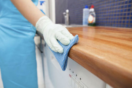 Wiping Cabinet With Sponge